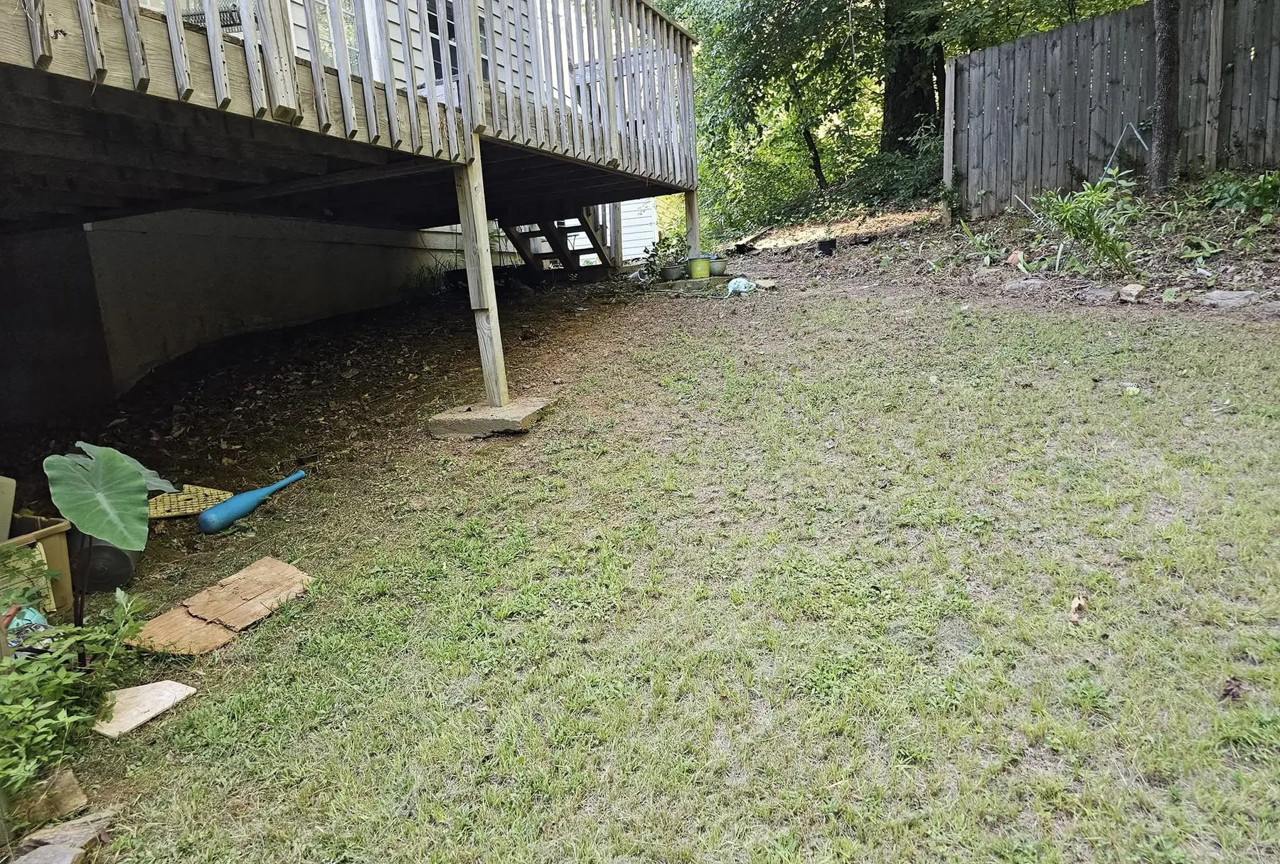 Ground under a deck cleared and leveled