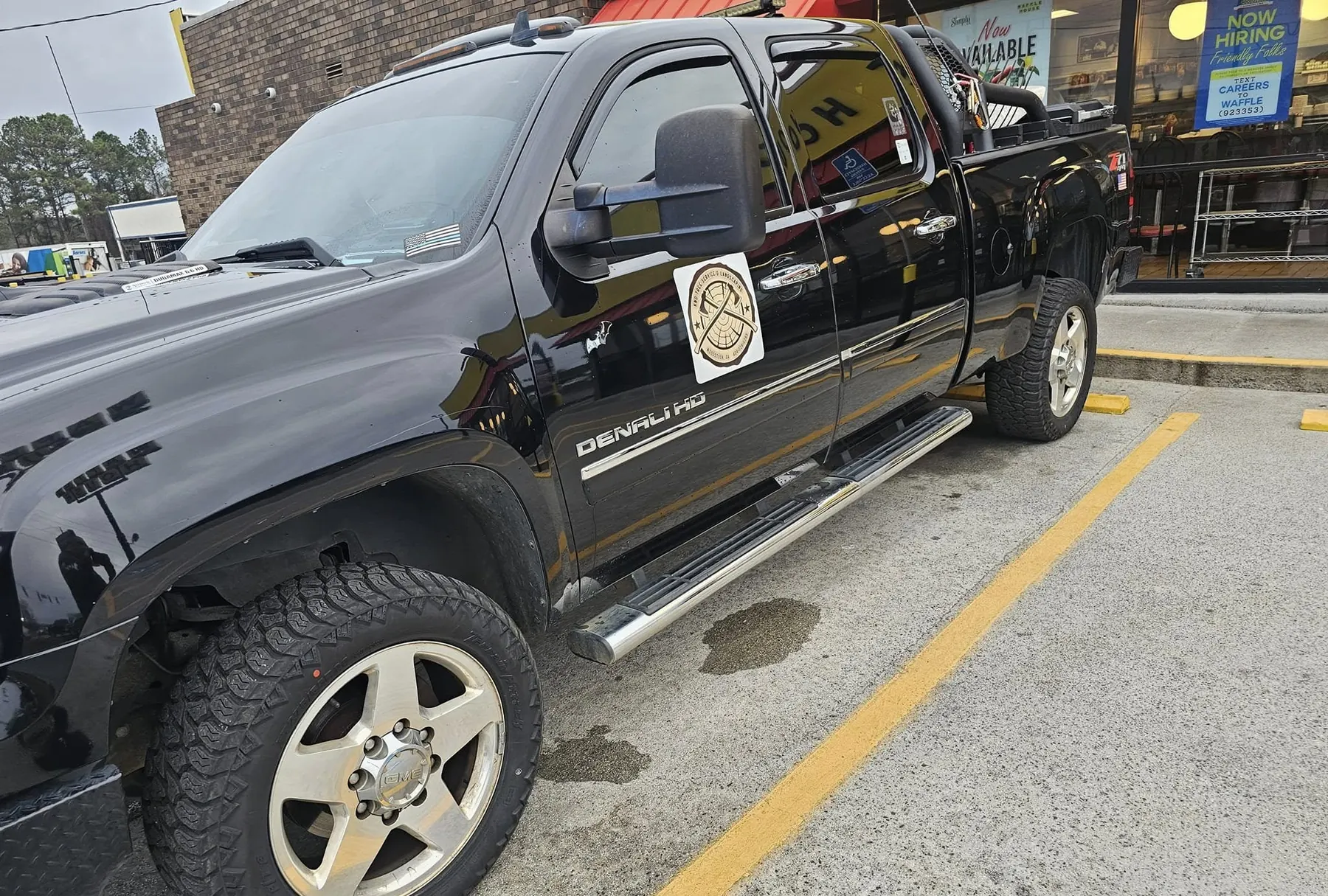 KND pickup with the company logo on the door